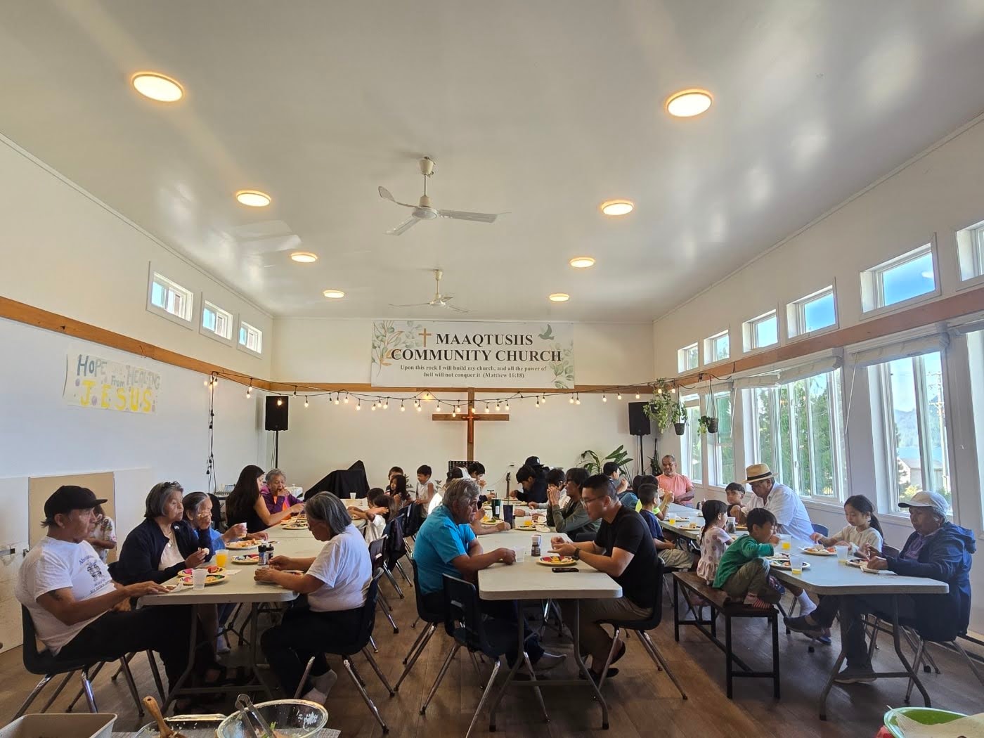 The Maaqtusiis Community Church congregation gathered for a fellowship meal inside the church building